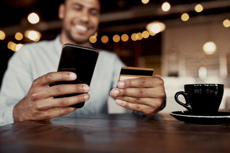 Man using phone to make an online payment