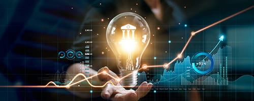 Data and a lightbulb floating over a person's hand.