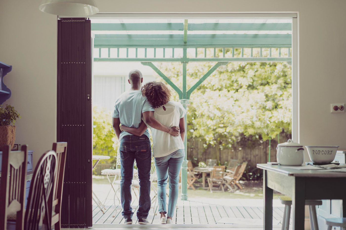 A couple holding each other at home