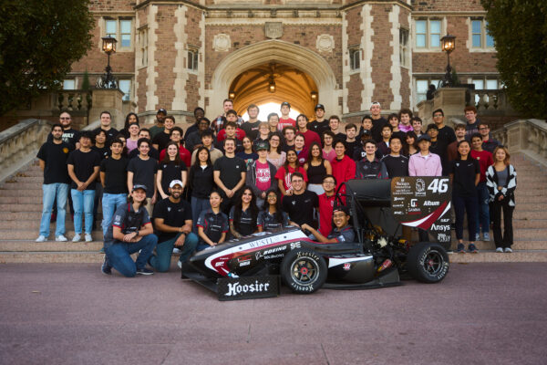 Washington University Formula SAE team with their EV car.