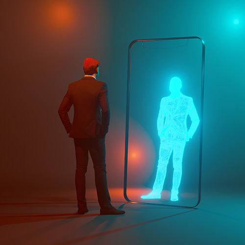 A man looking at digital version of himself in a mirror. 