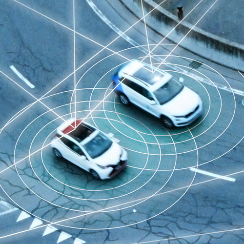 Cars driving in a roundabout connected by datapoints.