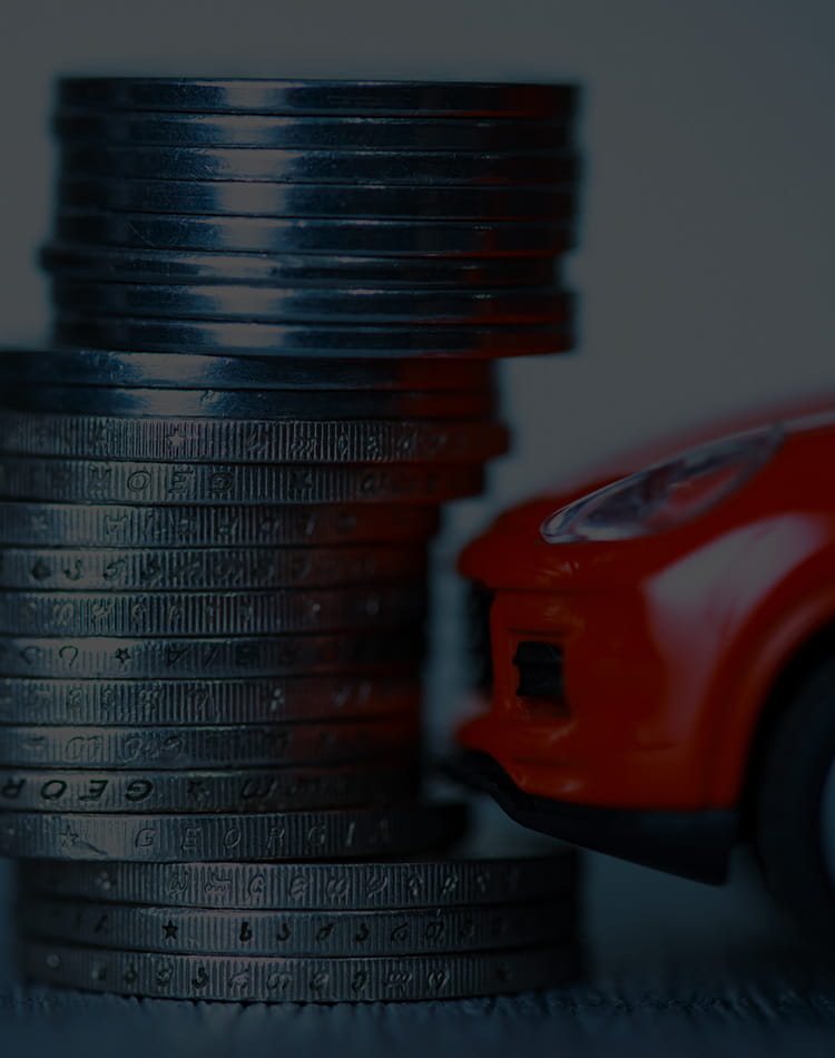 A stack of coins by a toy car, mobile hero.