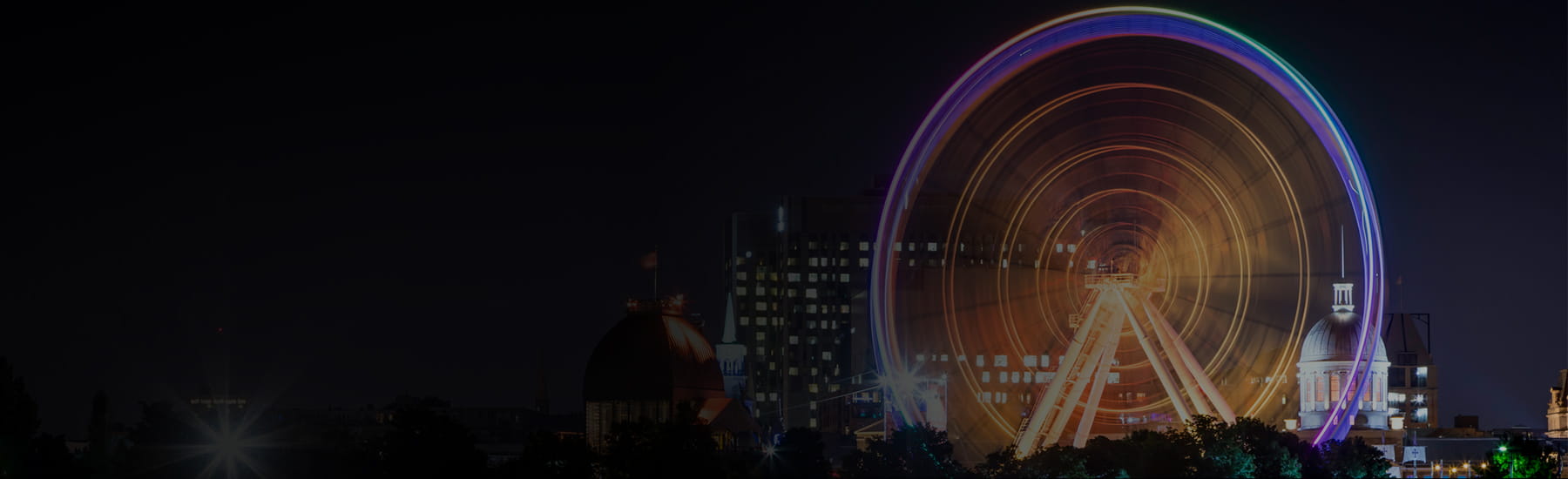 A carousel with purple and yellow glowing lights