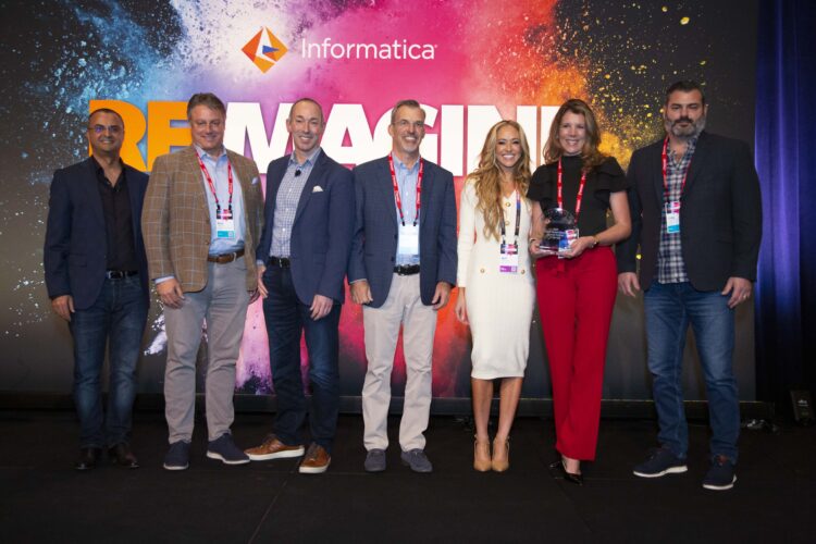 Perficient colleagues holding the Informatica Partner of the Year award.