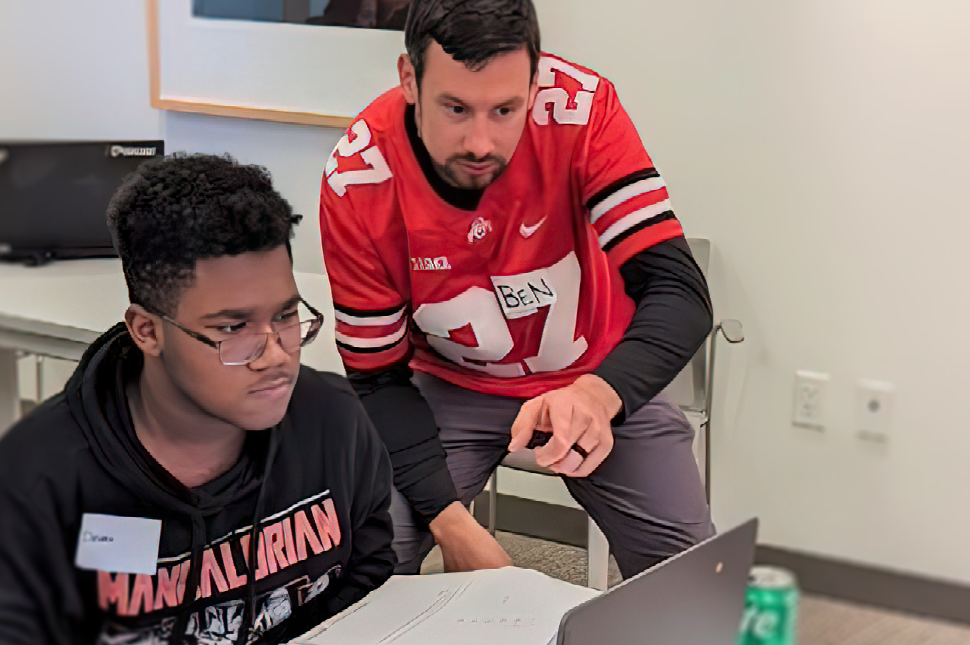 A student and mentor working together in the Mark CUban Foundation AI Bootcamp.