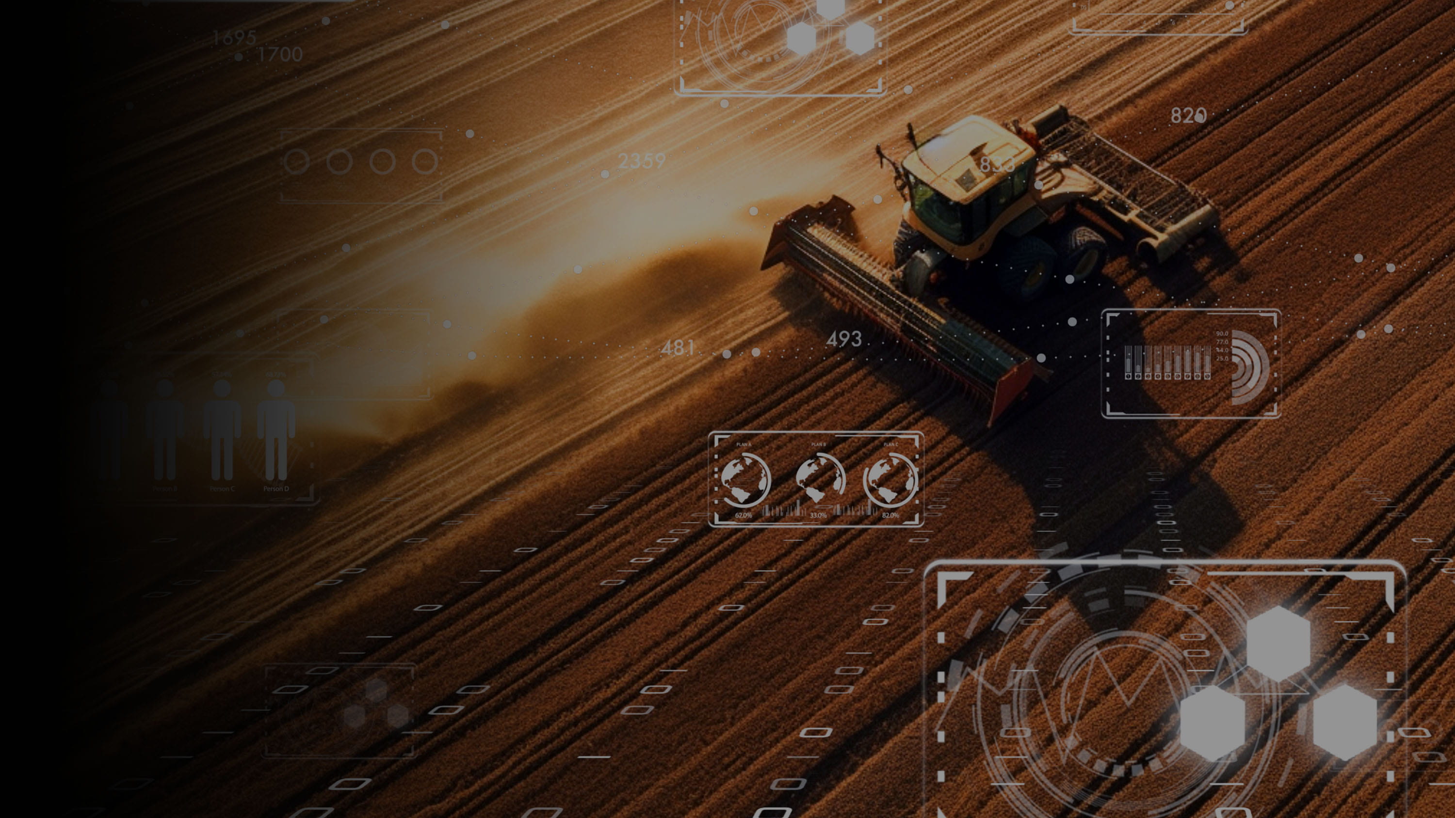 A tractor plowing a field of crops.