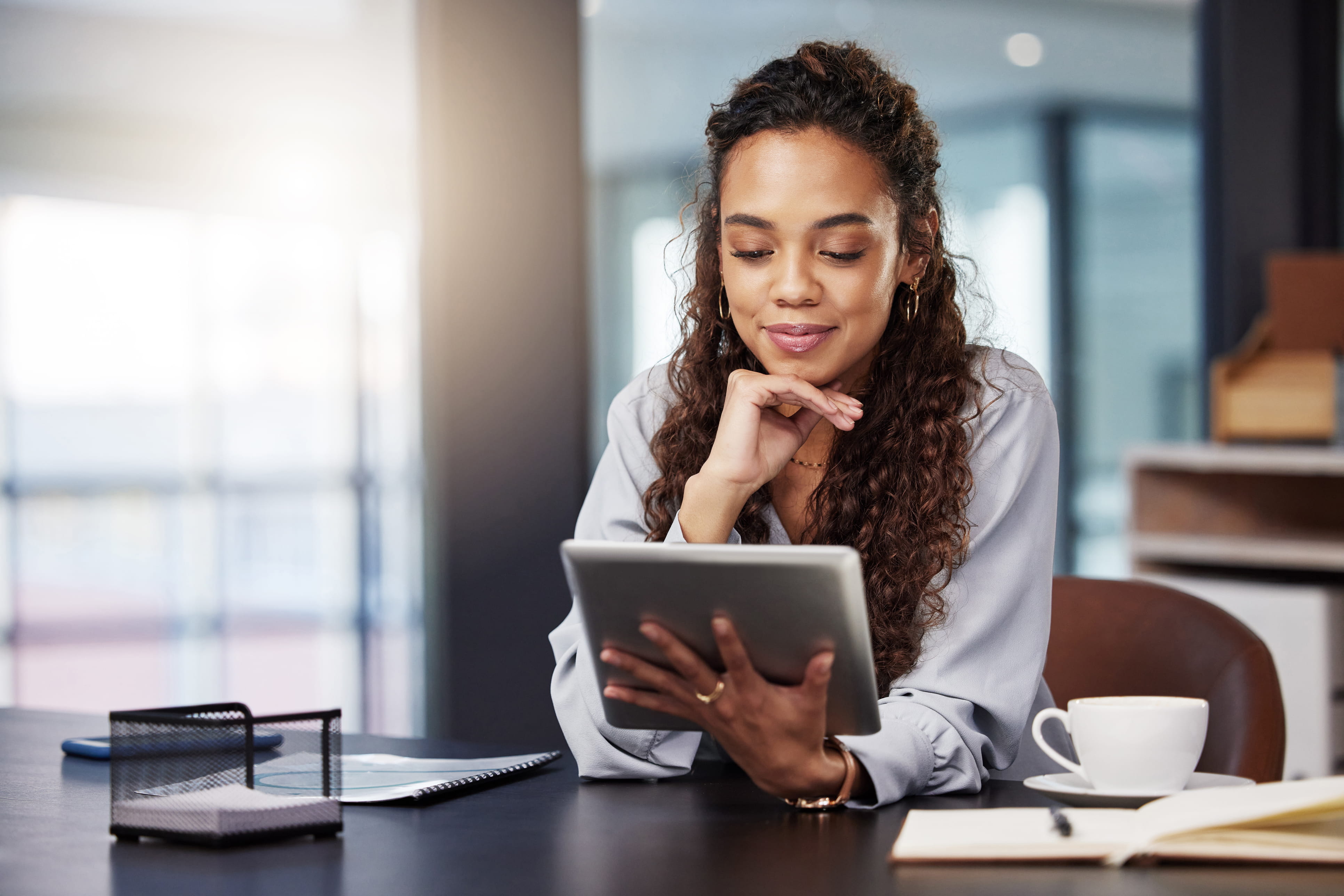 A woman looking at a tablet 