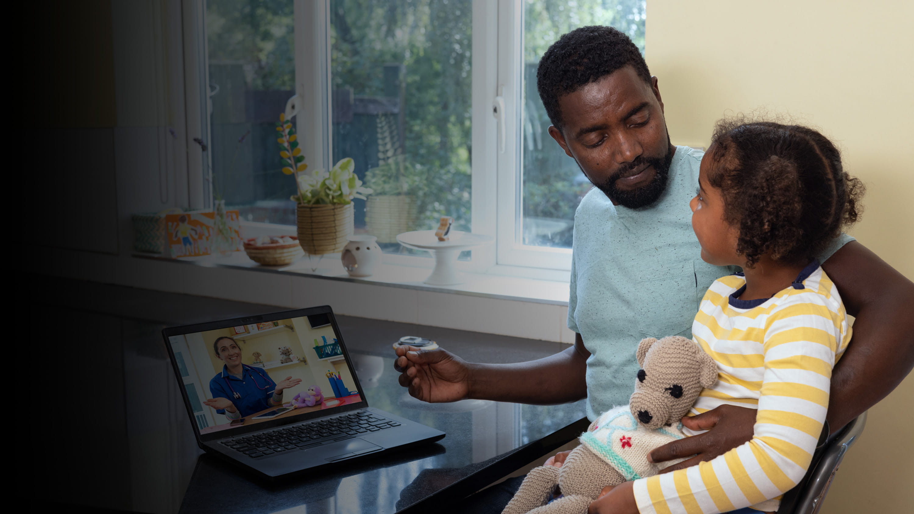 A dad taking care of his young daughter.