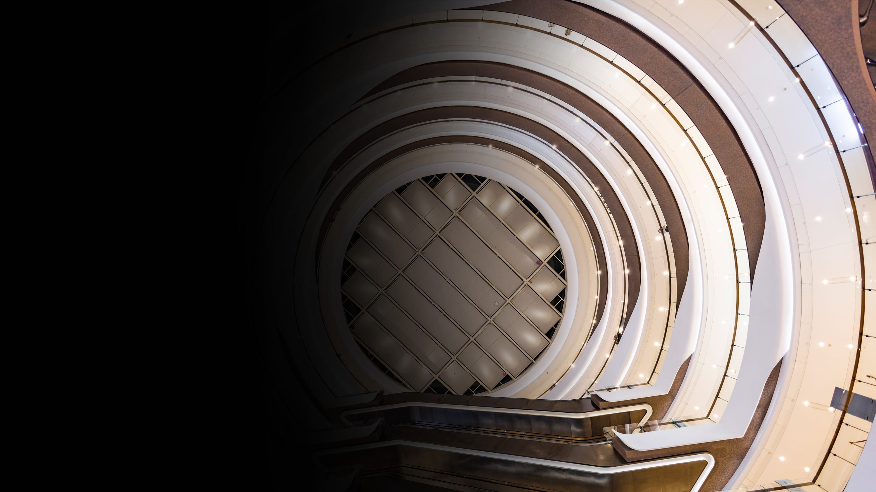 View up a spiral staircase in a luxury store.