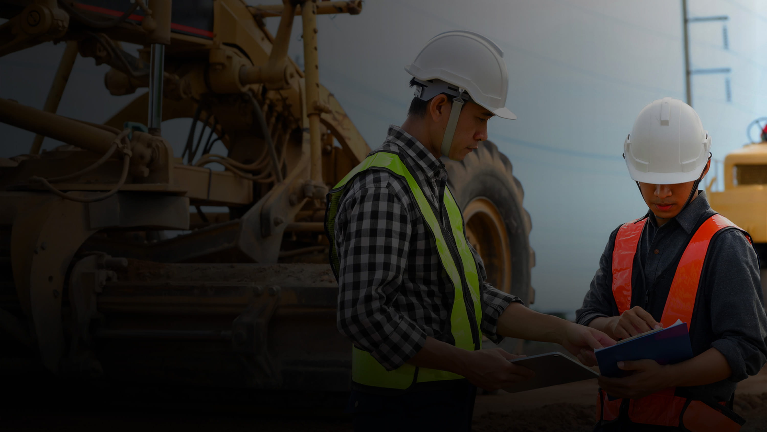 Workers in hardhats and safety vests.