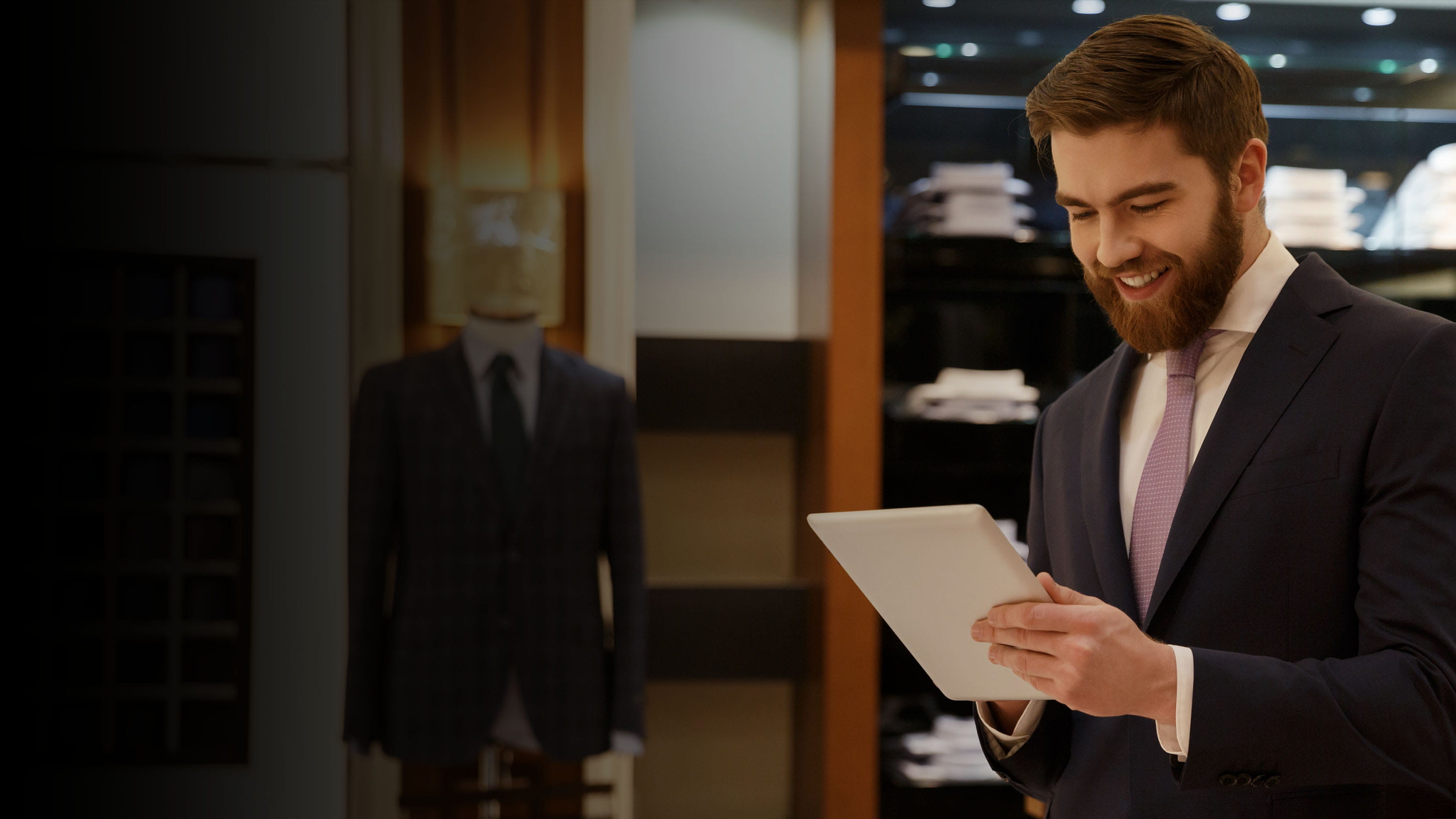 Man working at a suit shop