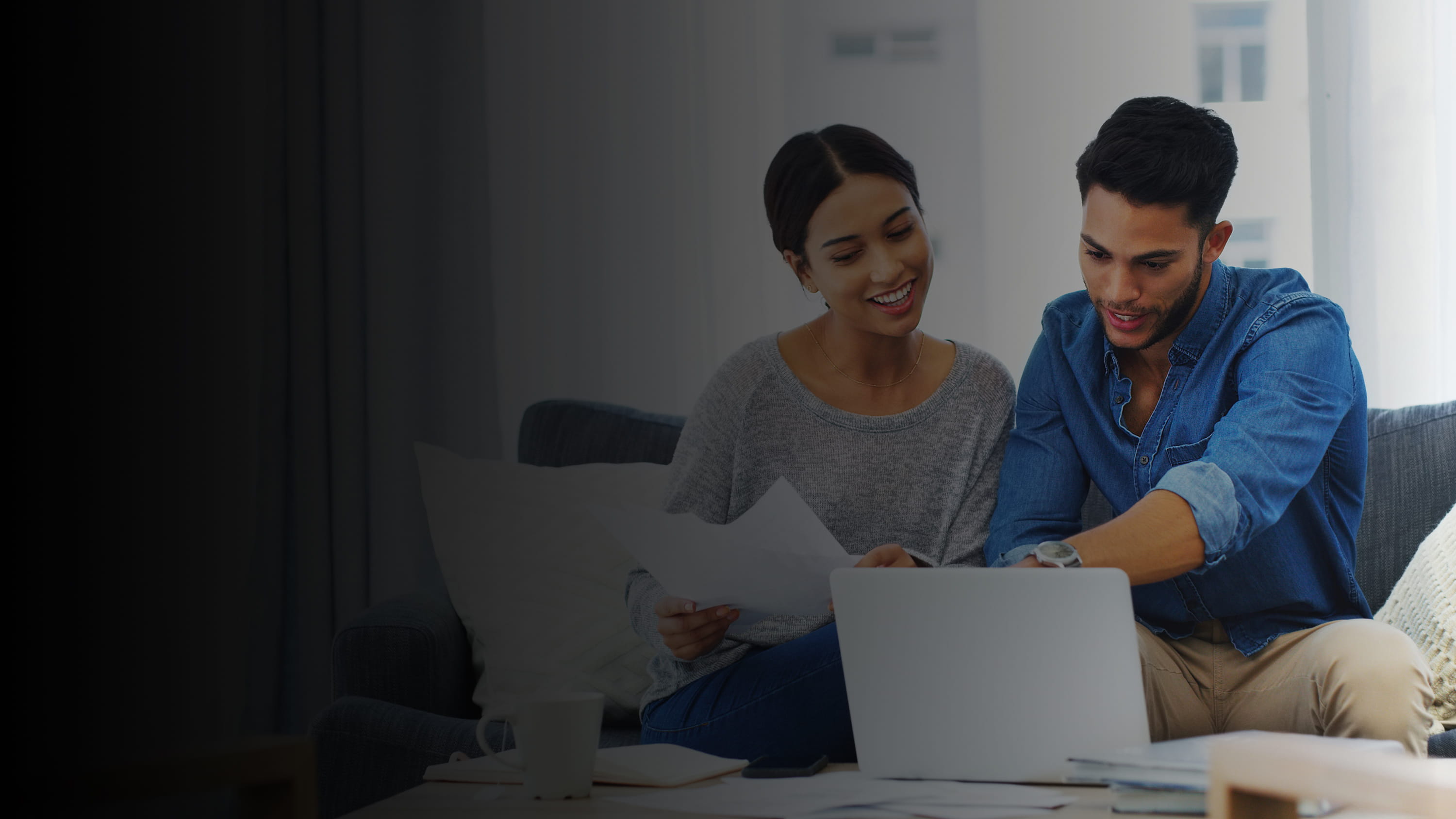 A woman and Man looking at a computer