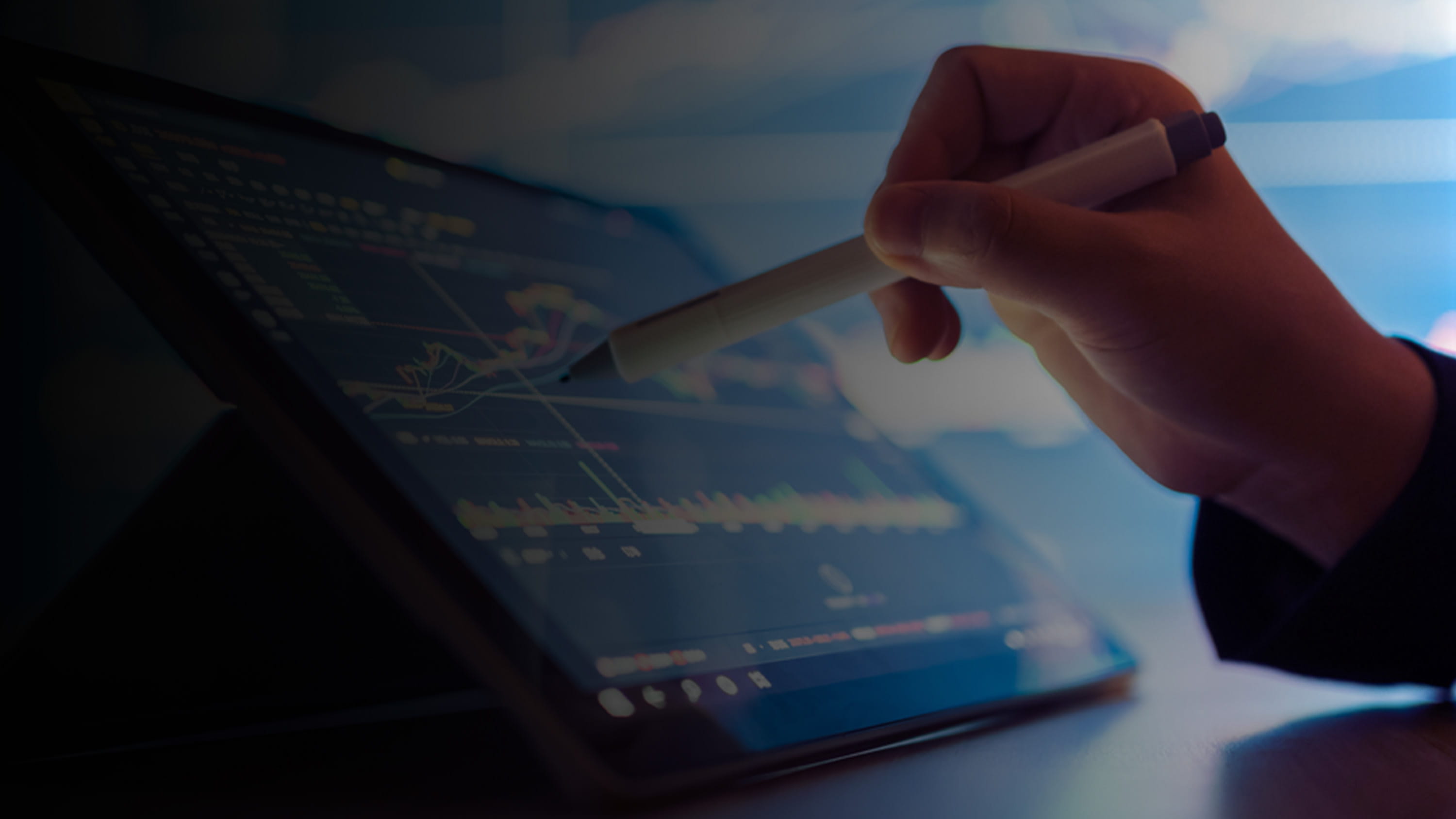 Person writing on a Tablet