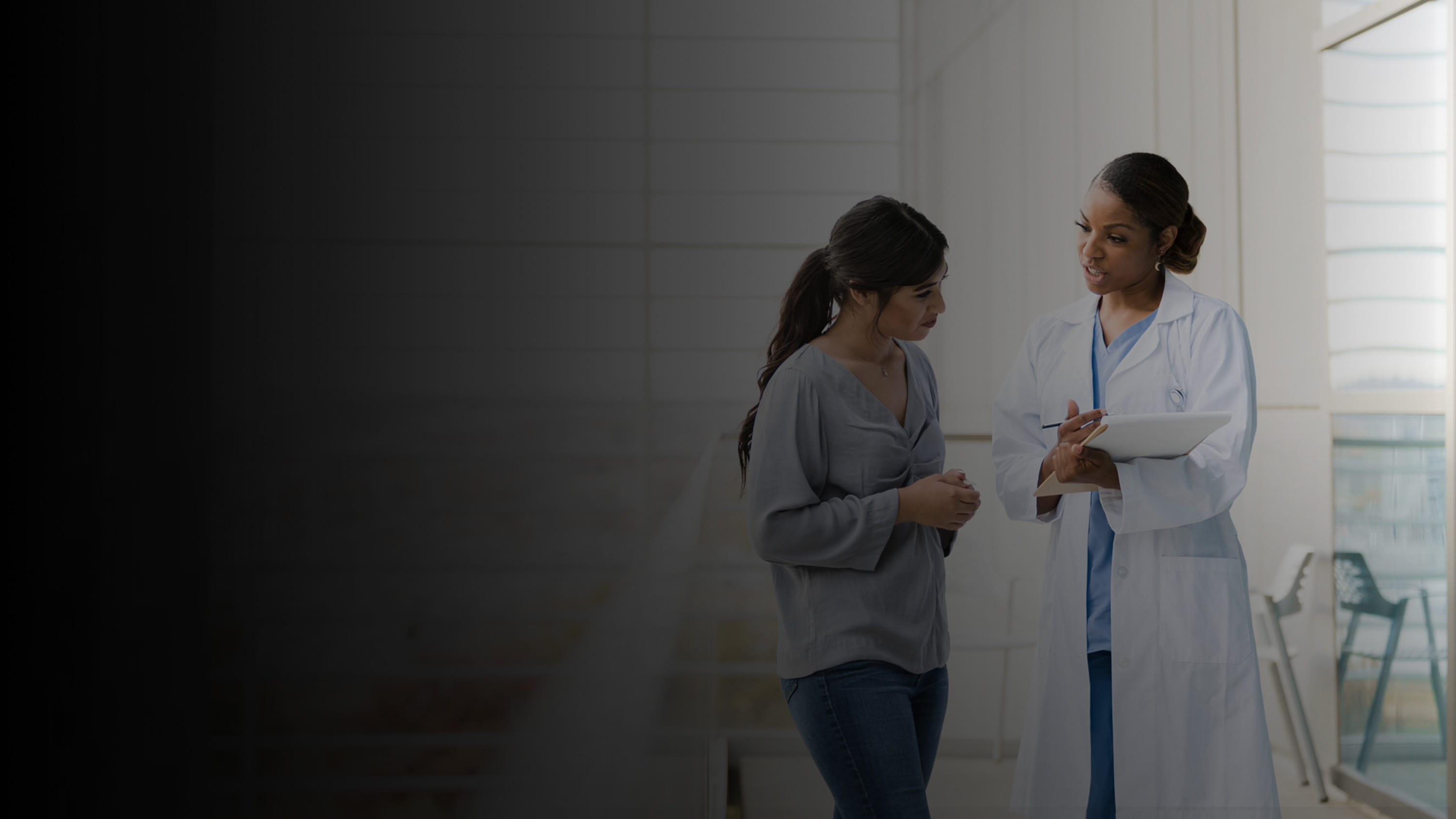 A woman talking to her doctor.
