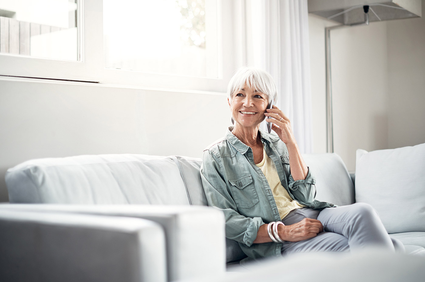 Older woman talking on a cellphone.