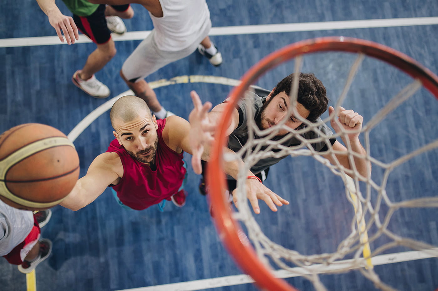 Men playing basketball.