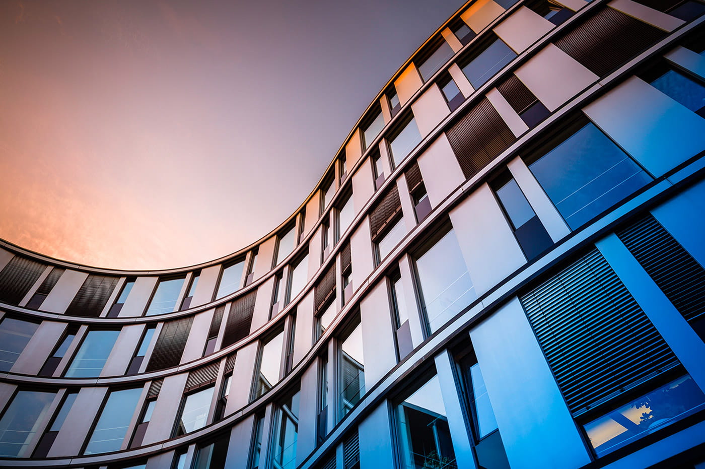 Building with curved walls and lots of windows.