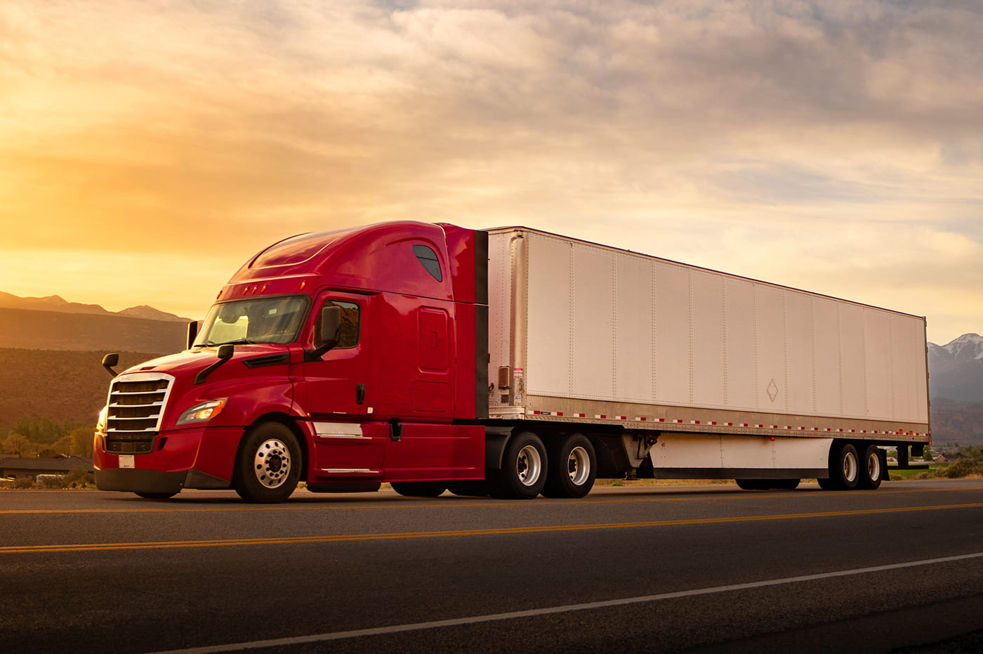 A large shipping truck driving.