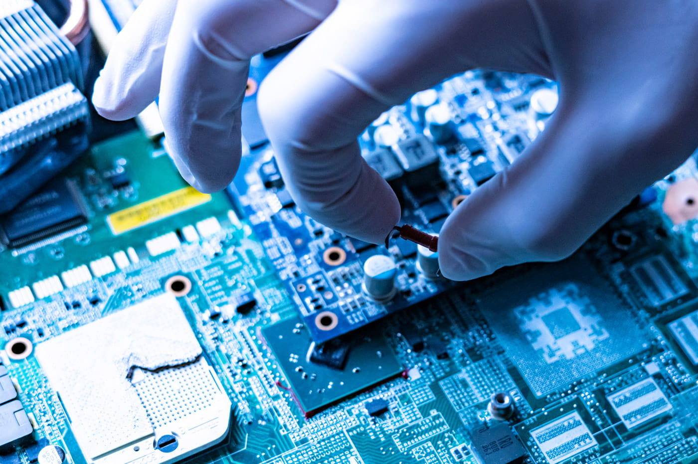 A person working on a circuit board