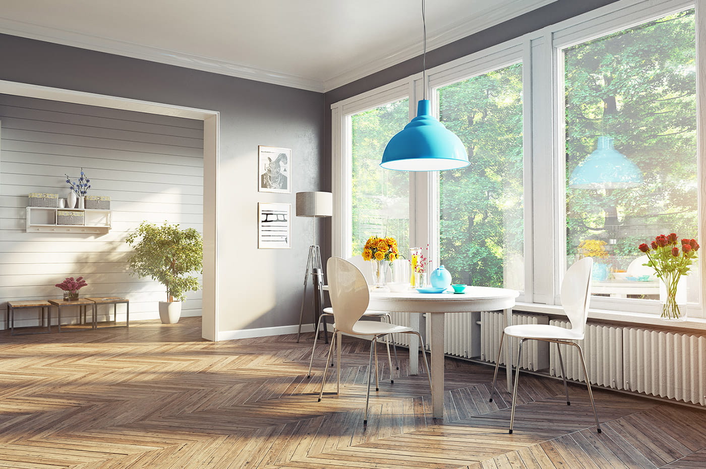 A dining room with table and chairs.