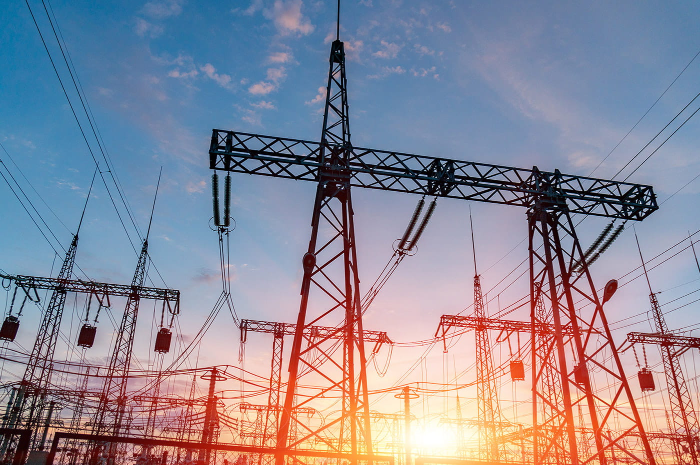 Power lines and wires at sunset.