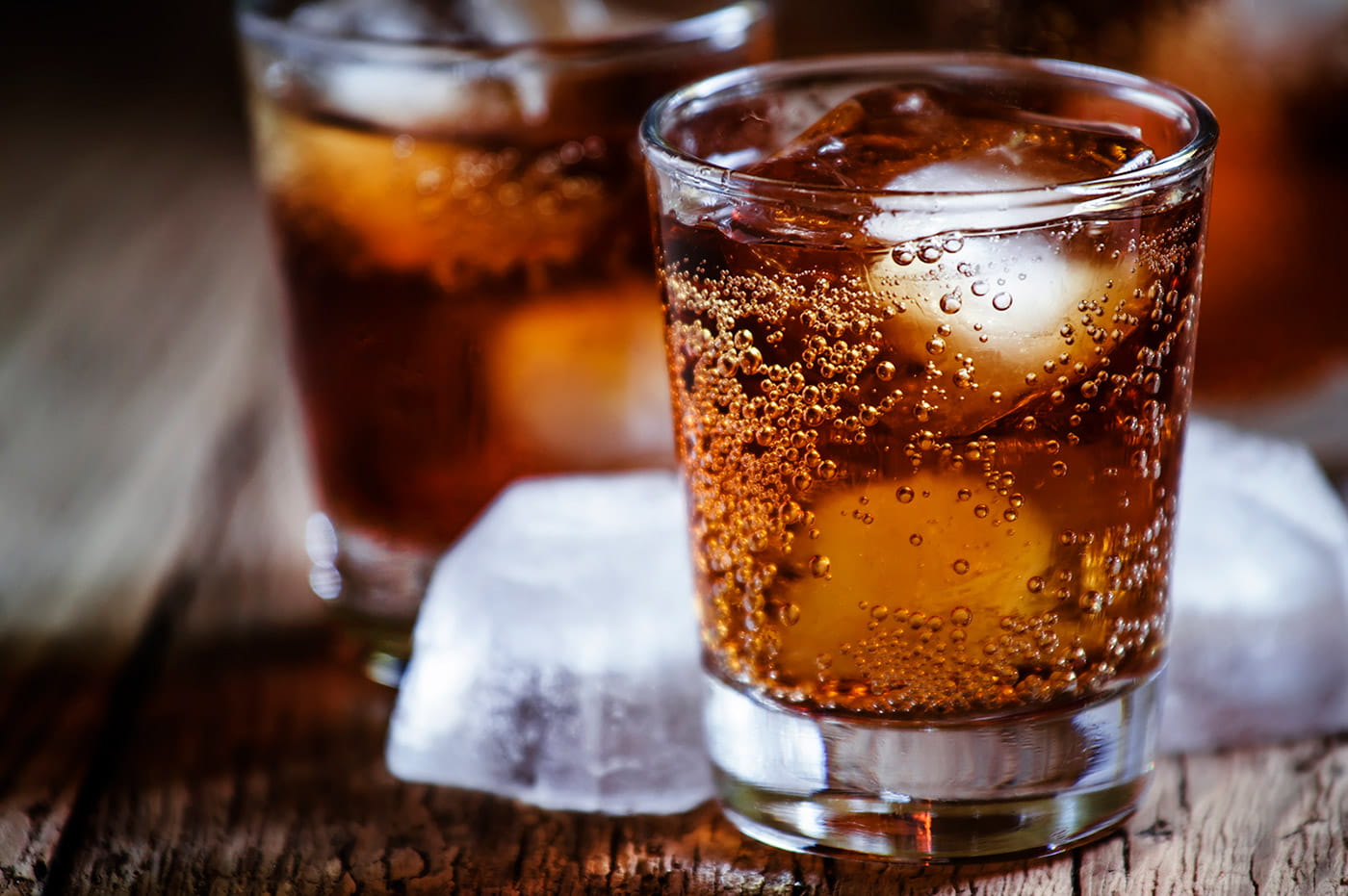 Glasses of a dark brown soda.