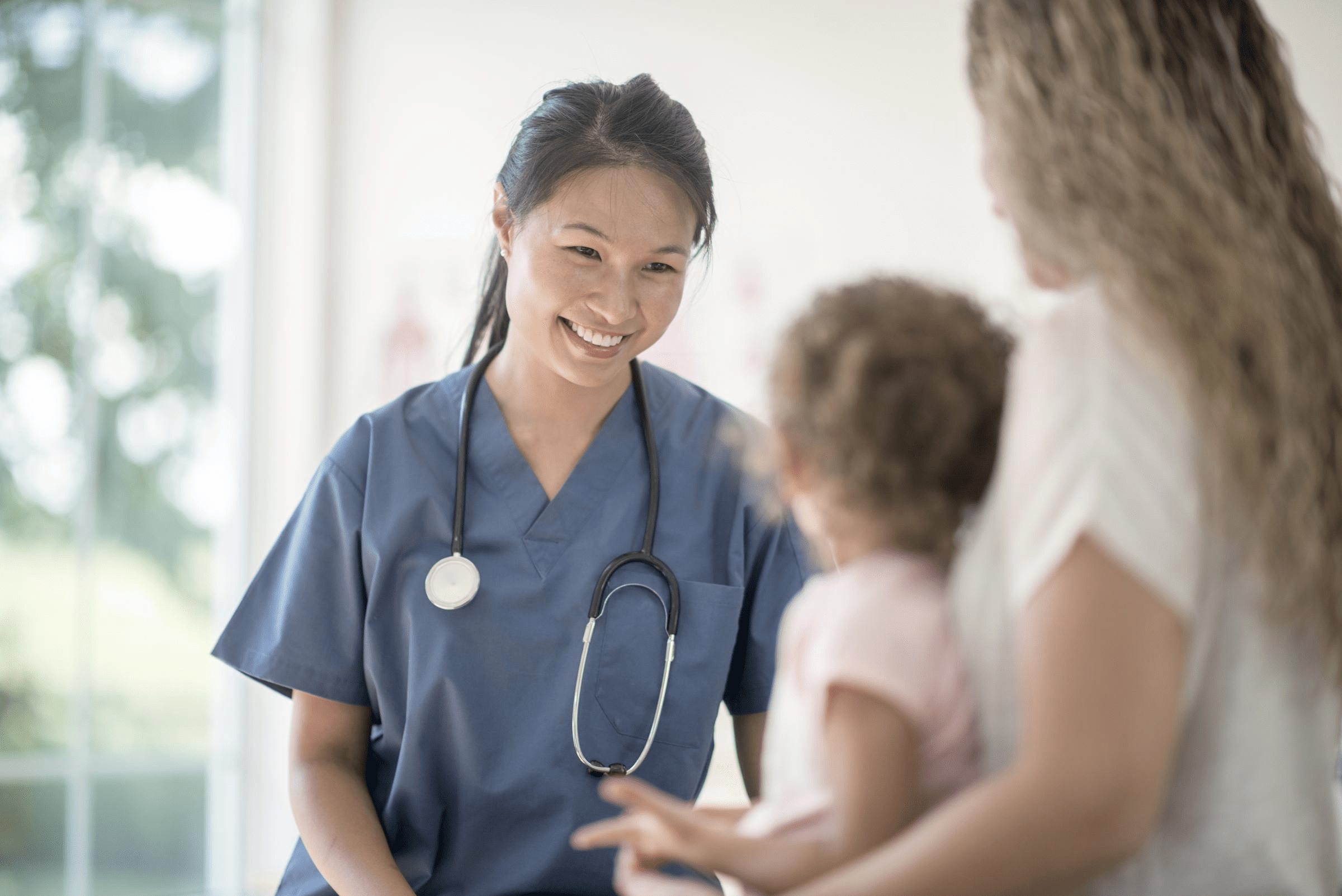 Doctor with a mother and child.