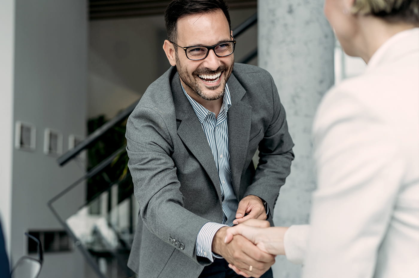 A man shaking a woman's hand 