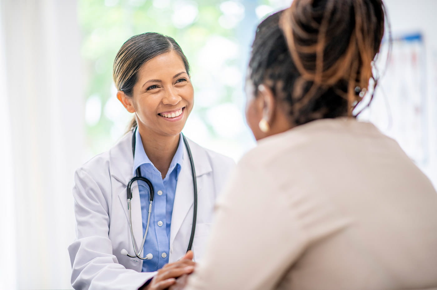 A female doctor talking to her patient.