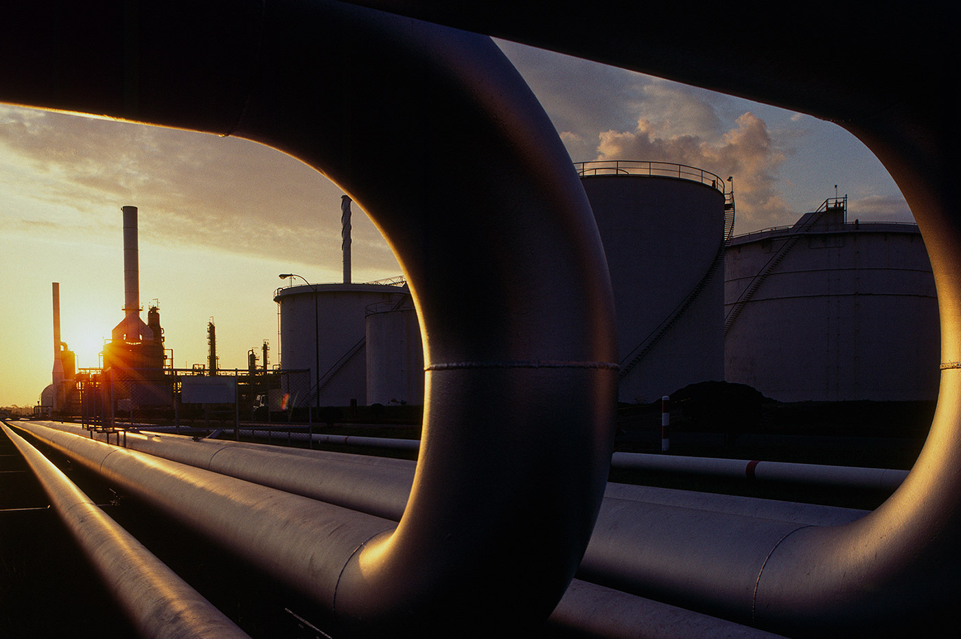 A view of an energy plant at sunset.