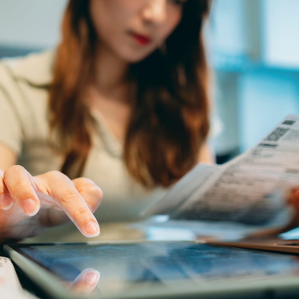 Woman using a tablet to work