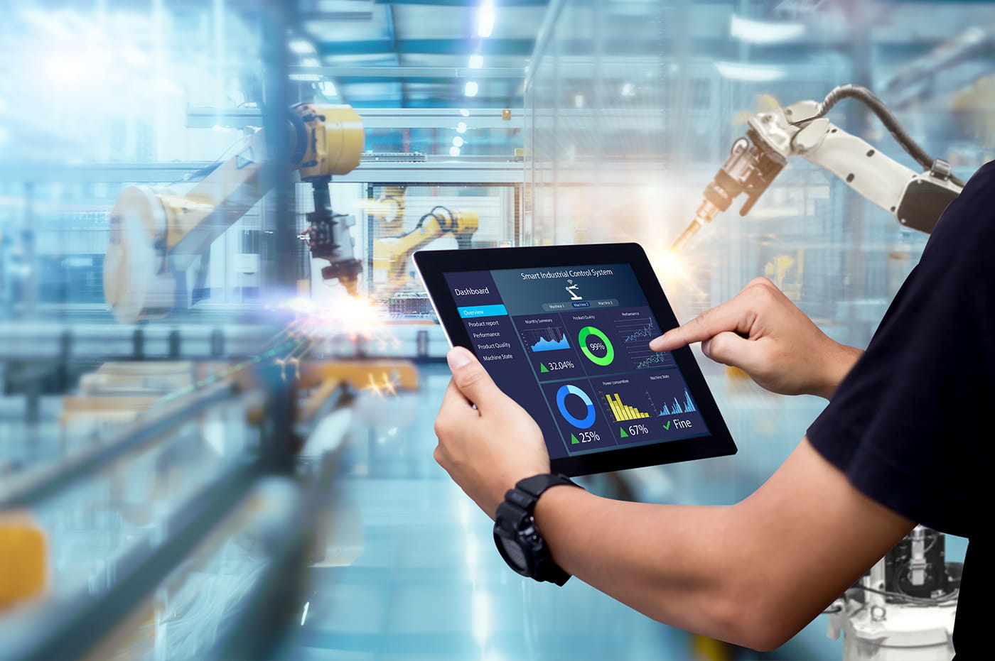 Someone using a tablet in a manufacturing plant.