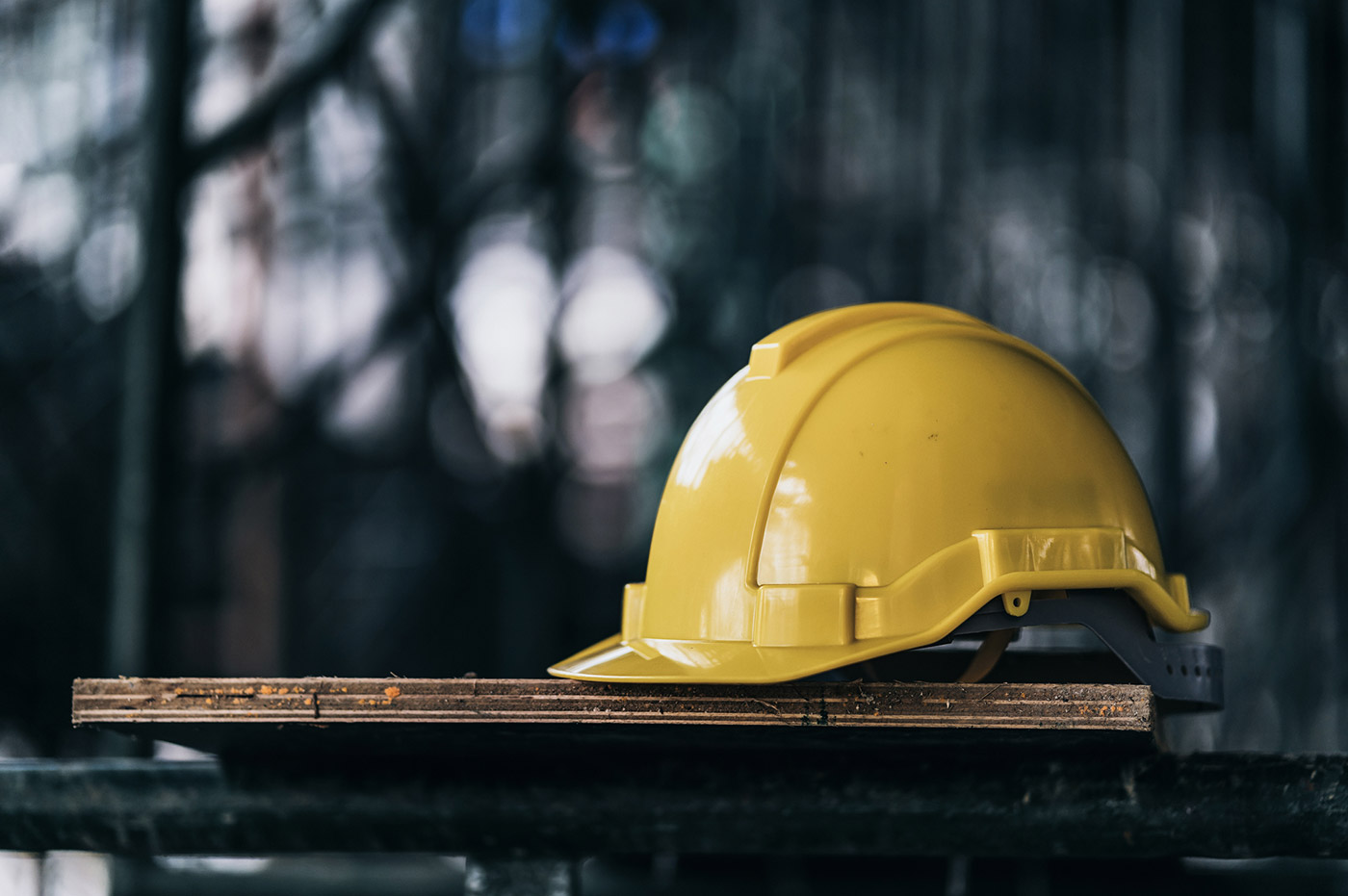 A yellow hard hat at a construction site.