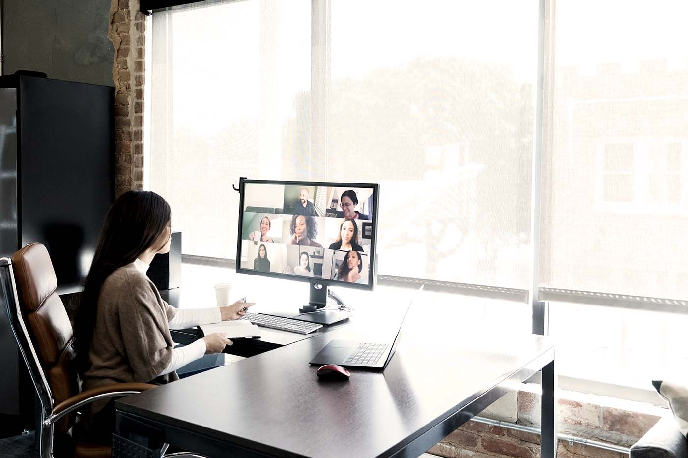 Person at desk on a video conference.