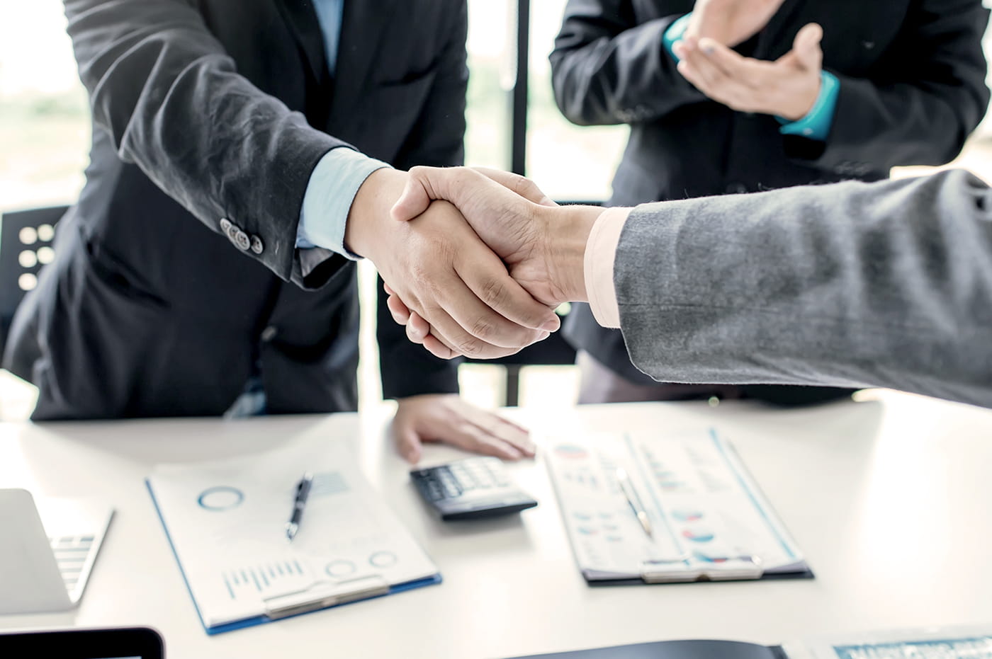 Two people shaking hands.