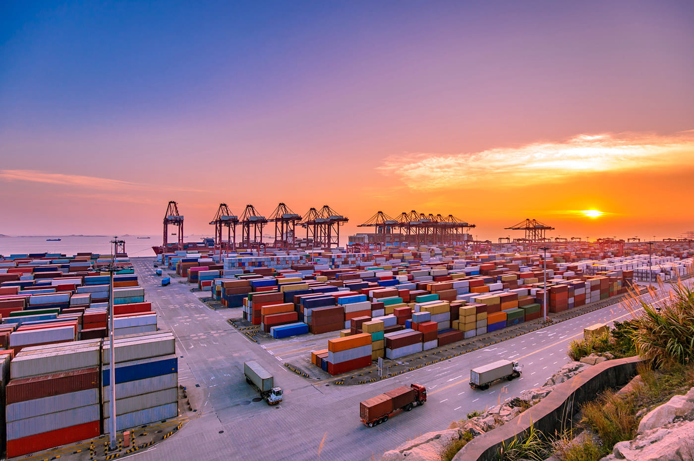 A large shipping yard at sunset.