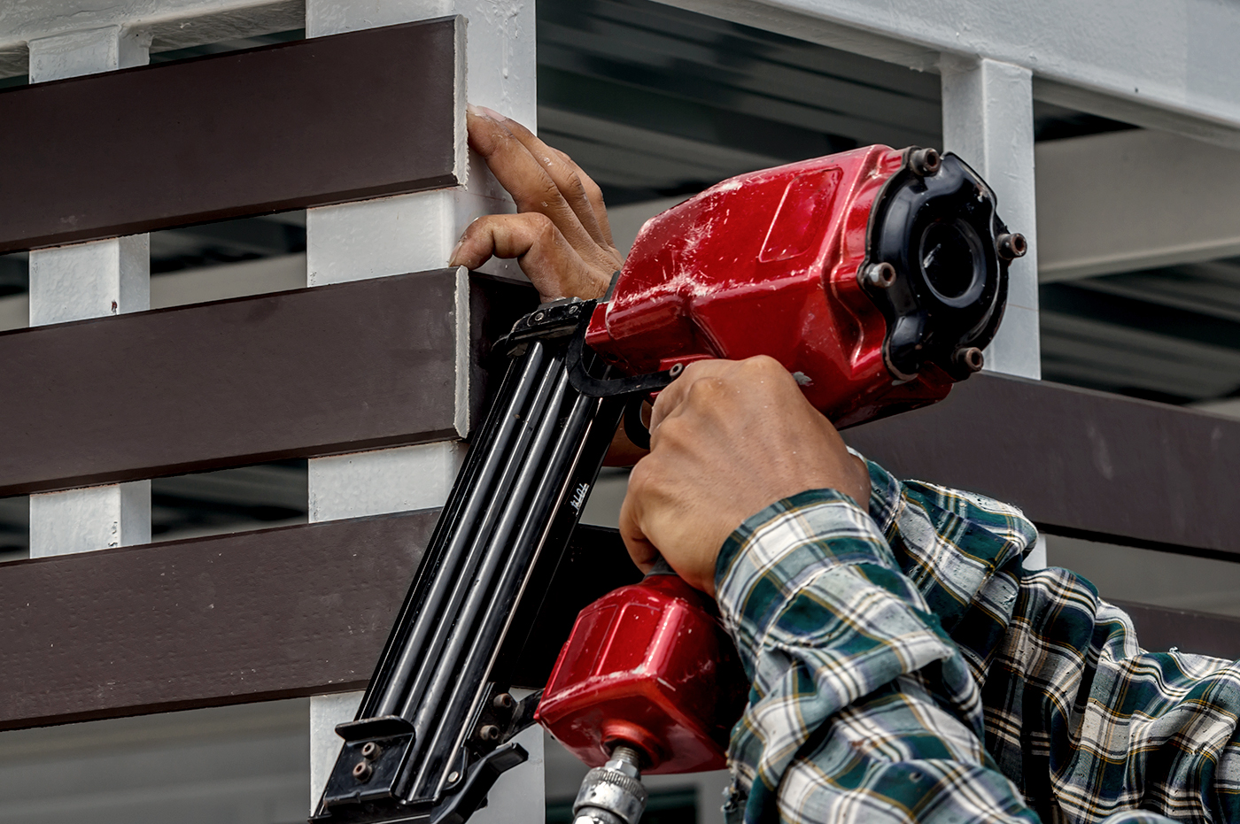 A person using a tool on a construction site.