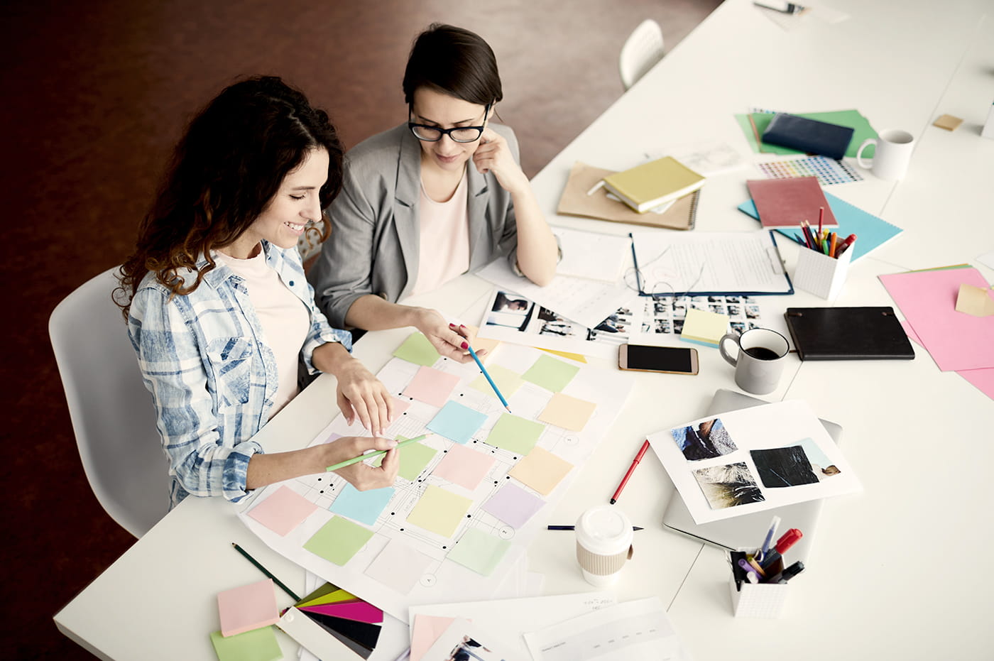 Two women working together on design.