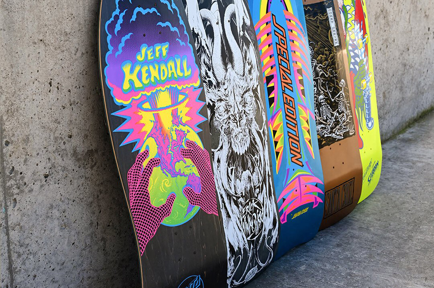 A row of brightly-decorated skateboards.
