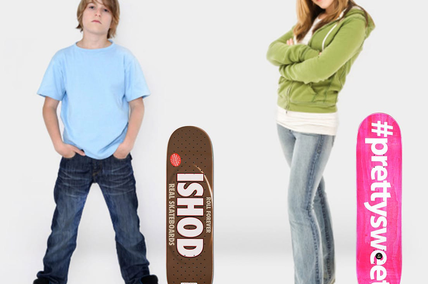 Two children standing next to their skateboards.