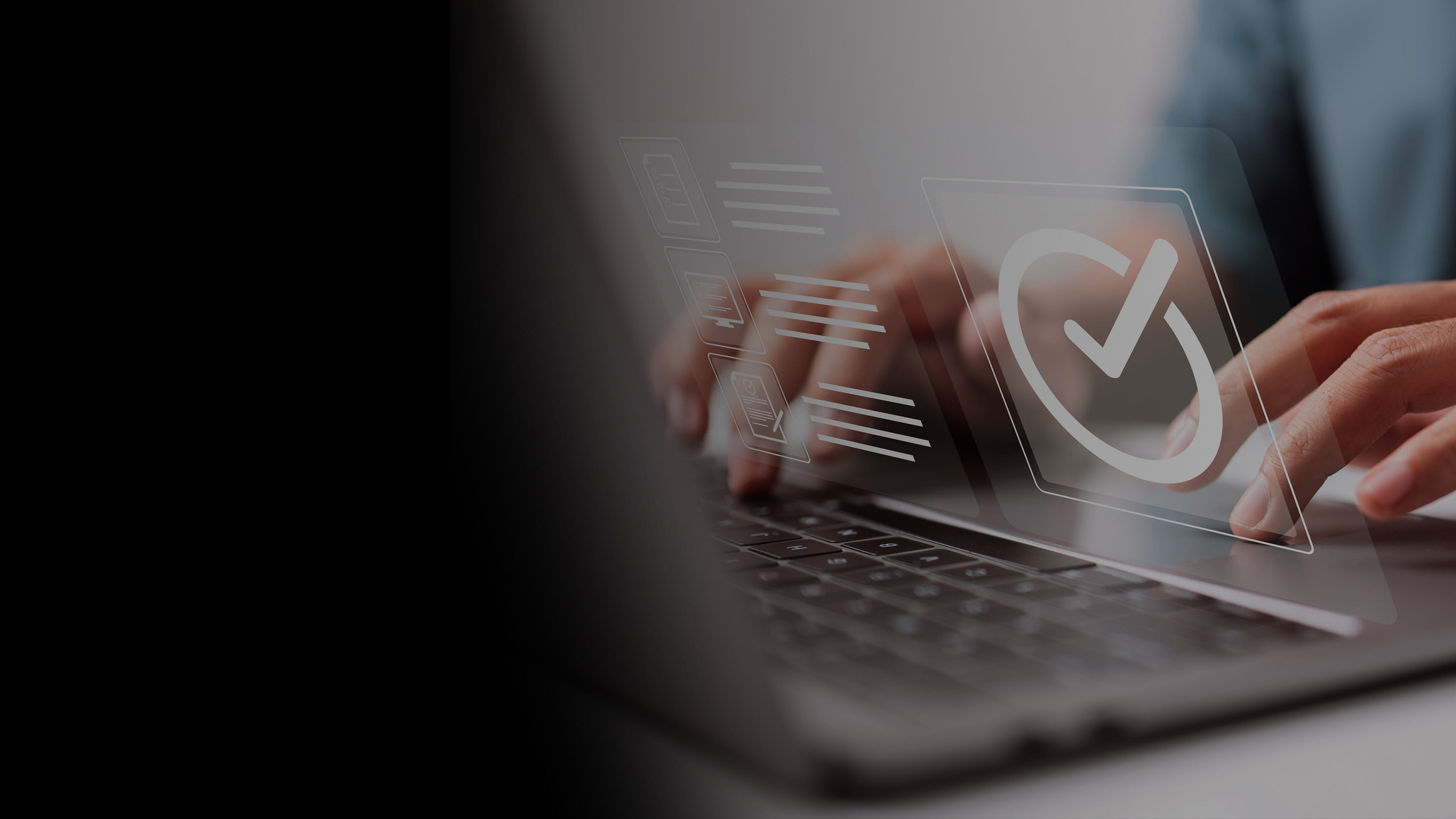 A man working on a laptop with a translucent image of the webpage hovering above the keyboard. 