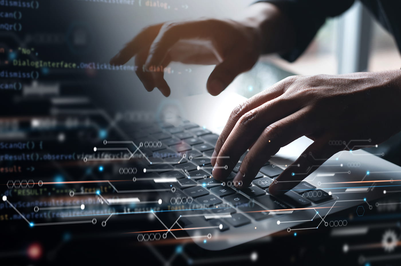 Hands typing on a keyboard.