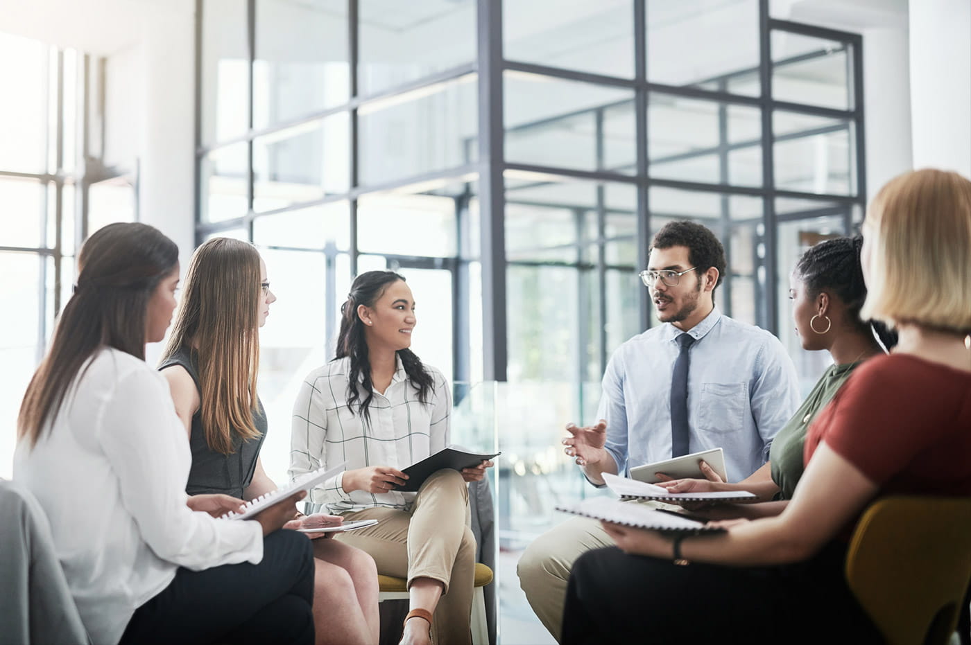 A group of colleagues in a brainstorming meeting. 