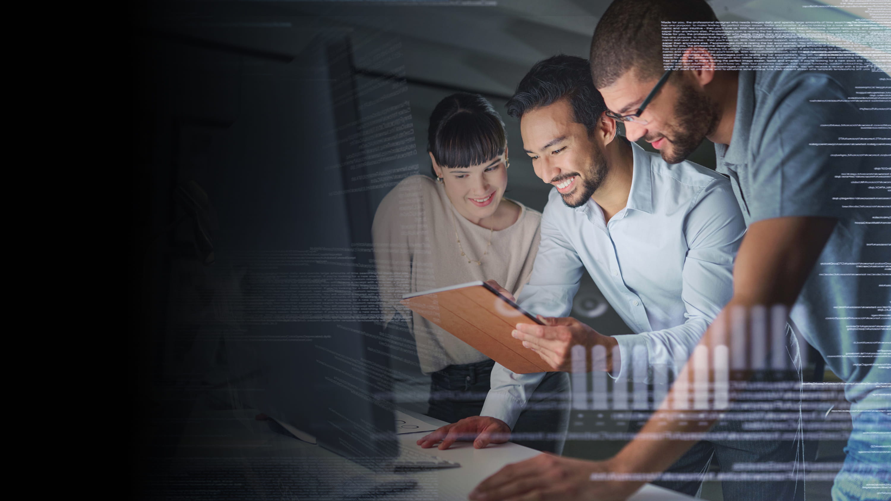 A group of colleagues working on a computer.