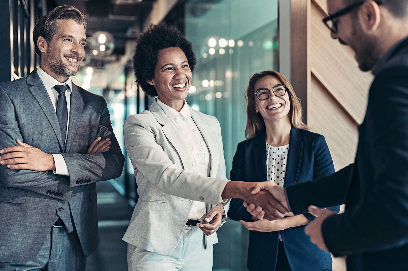 A group of professionals shaking hands.