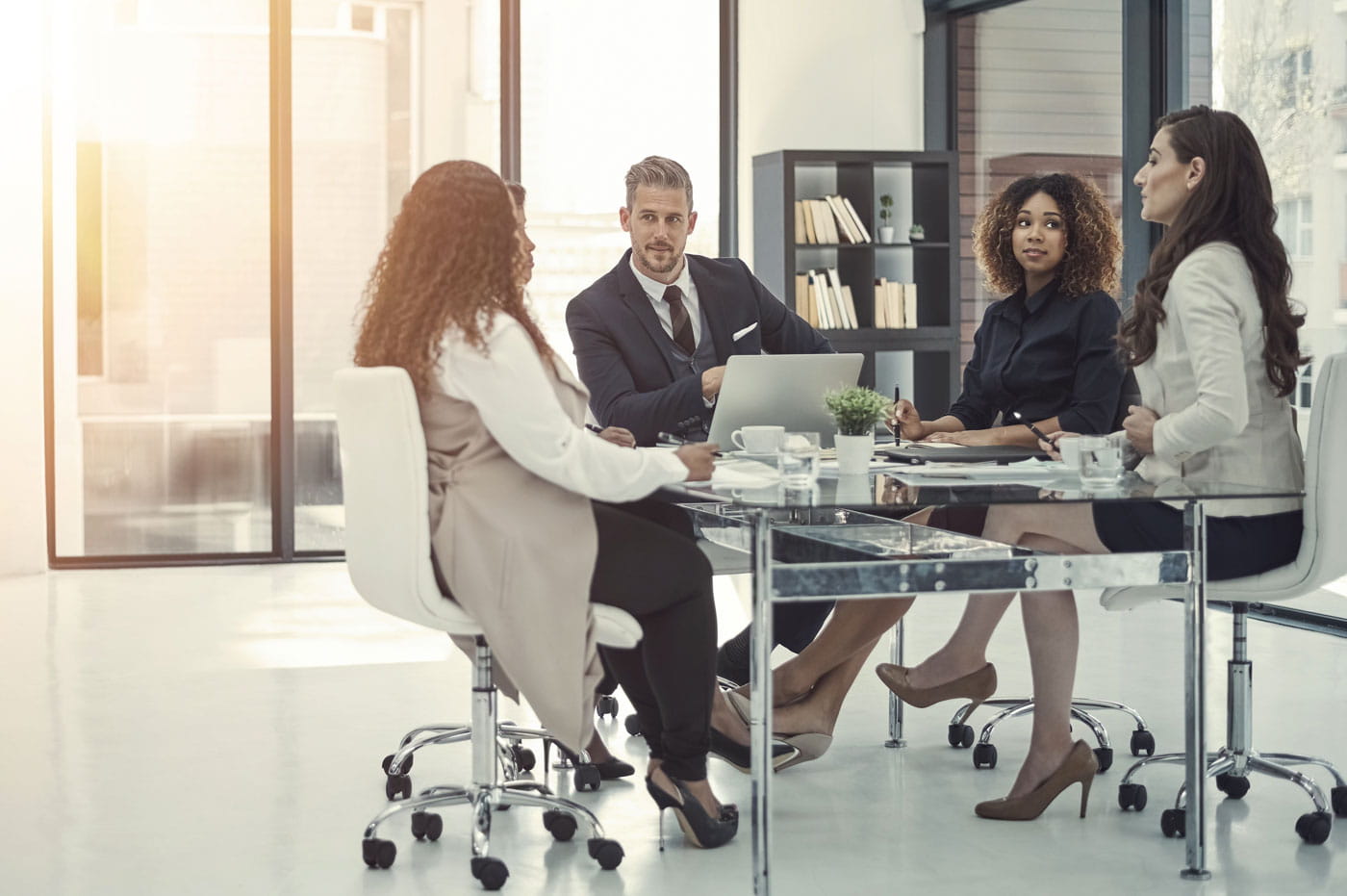 A small meeting taking place at a conference table.