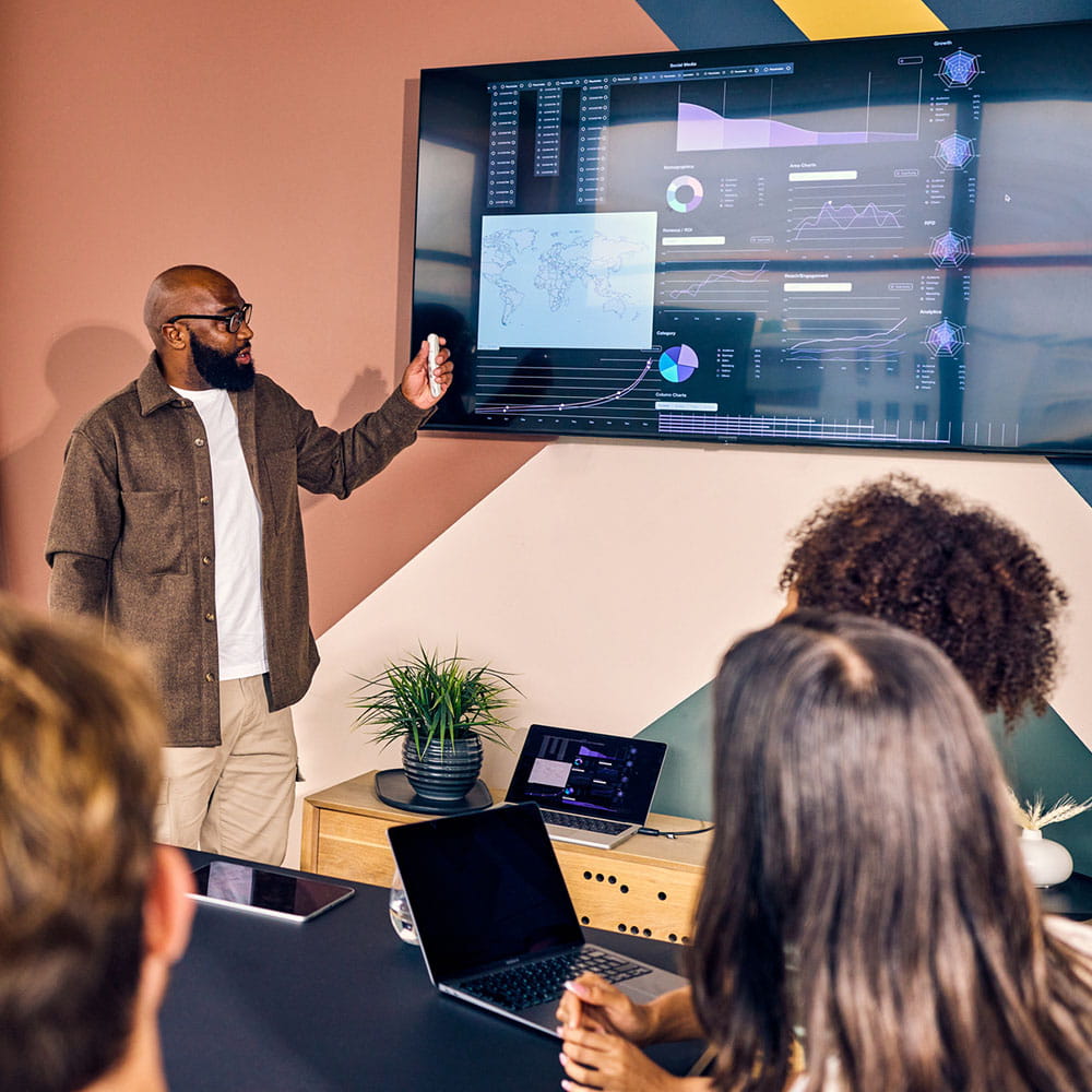A group of colleagues reviewing data in a meeting.