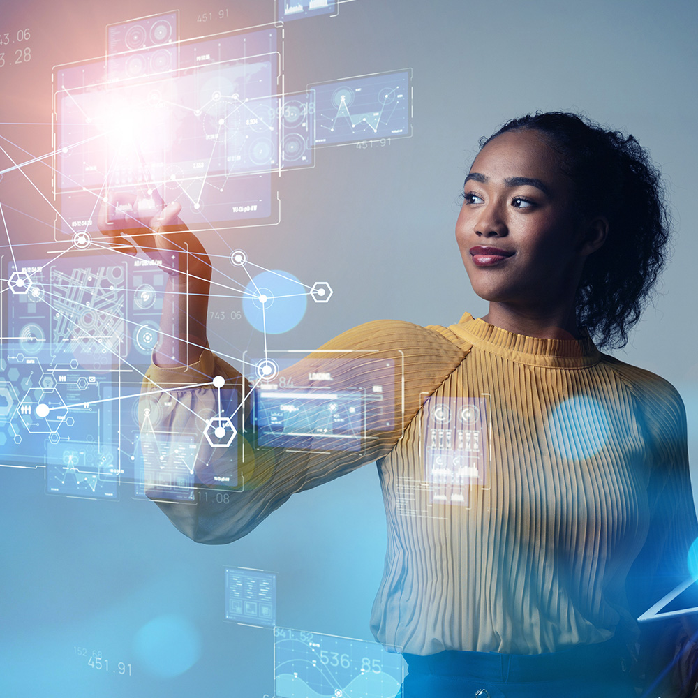 A woman interacting with holographic diagrams and data.