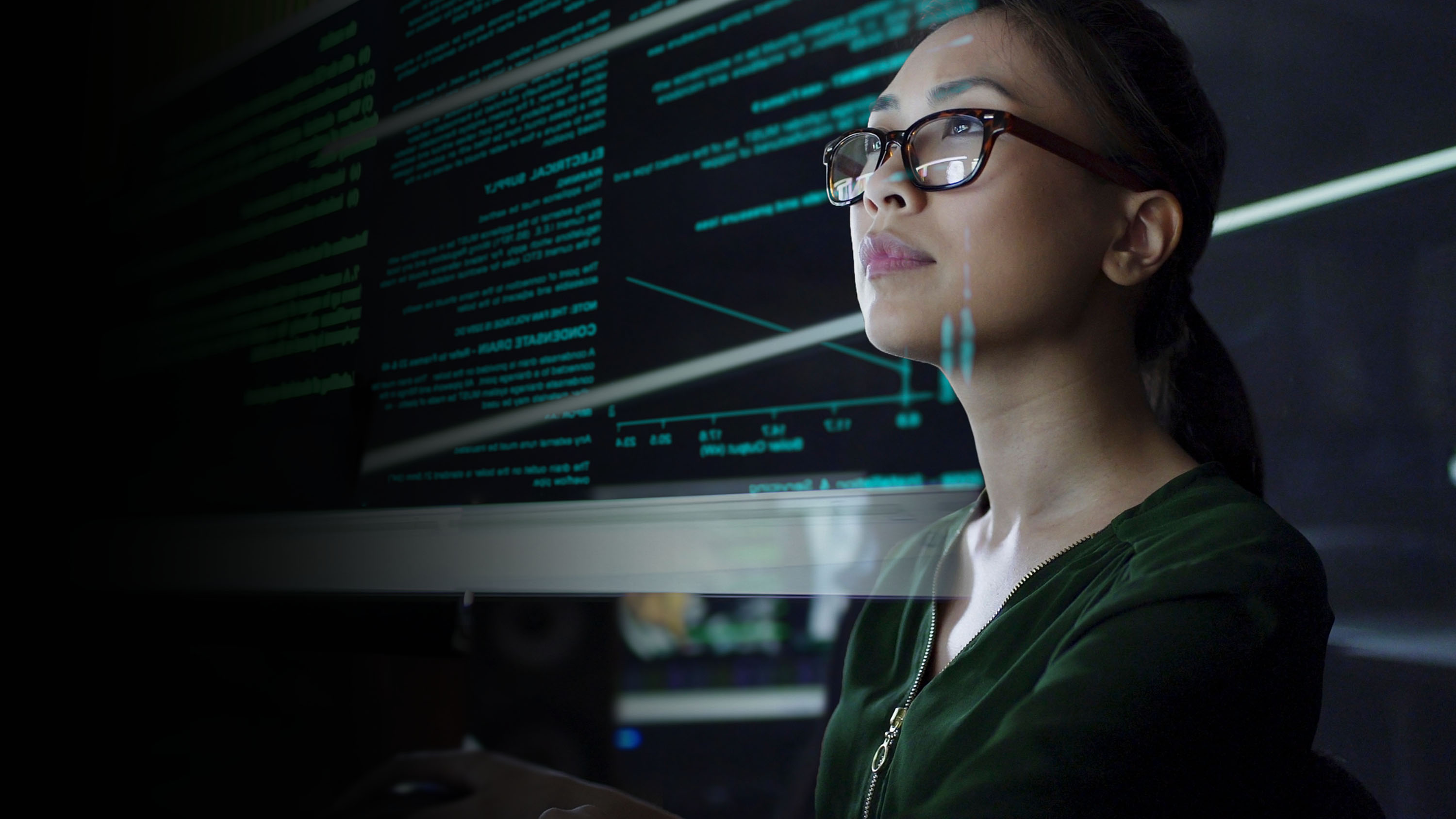 A young woman coding.